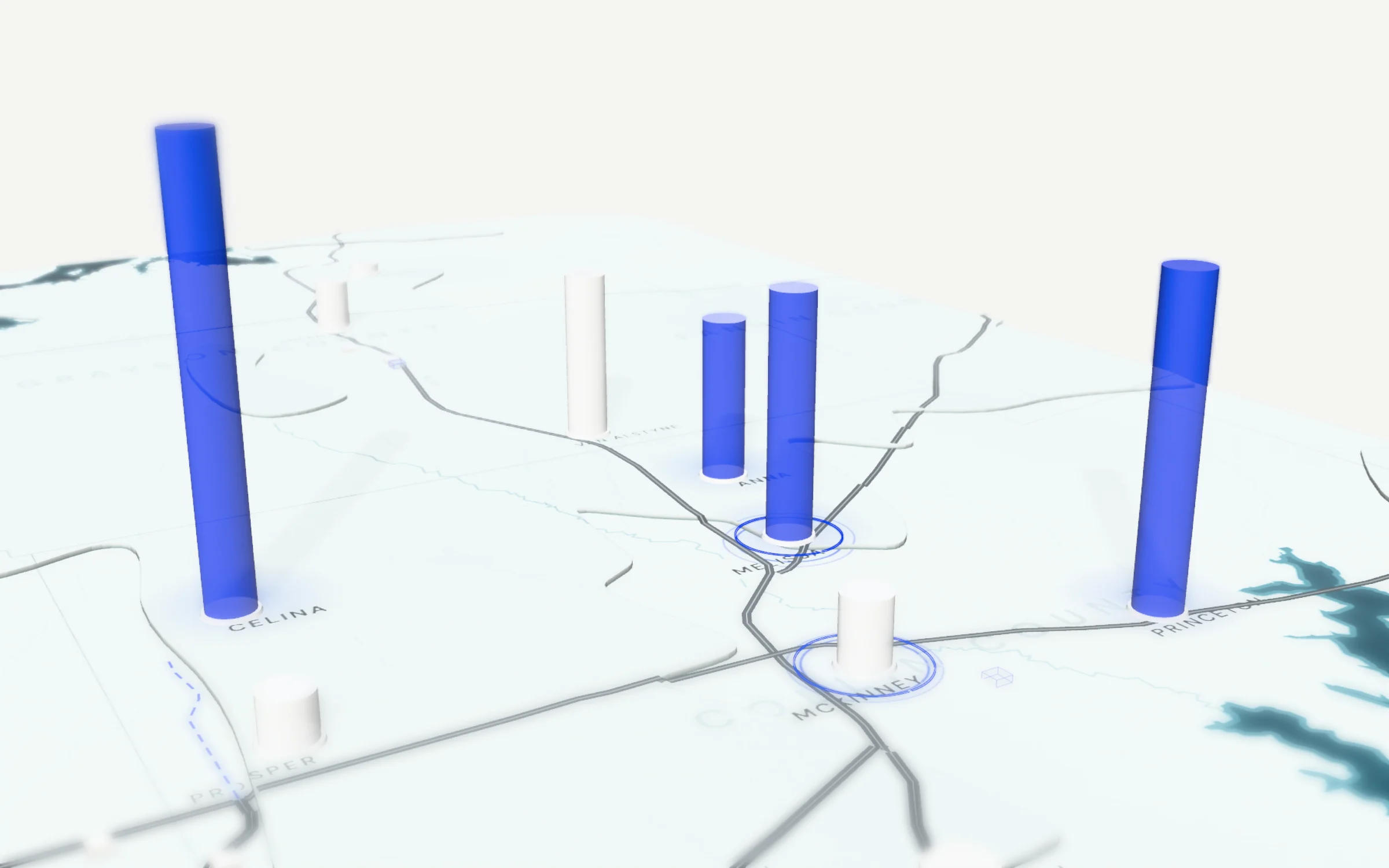 A close view of the model below: a frosted-glass map of North Texas with a glass column at each city as tall as it grew in a year, four of them in blue at Celina, Princeton, Melissa and Anna