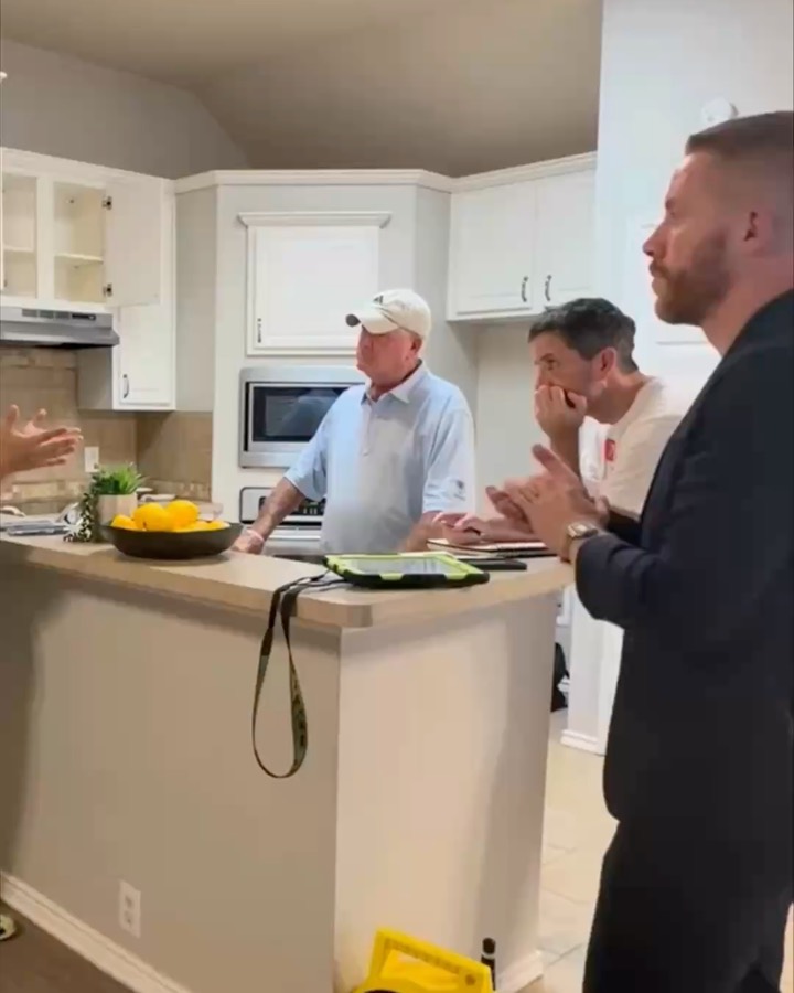 With clients at their kitchen island on a home visit, listening
